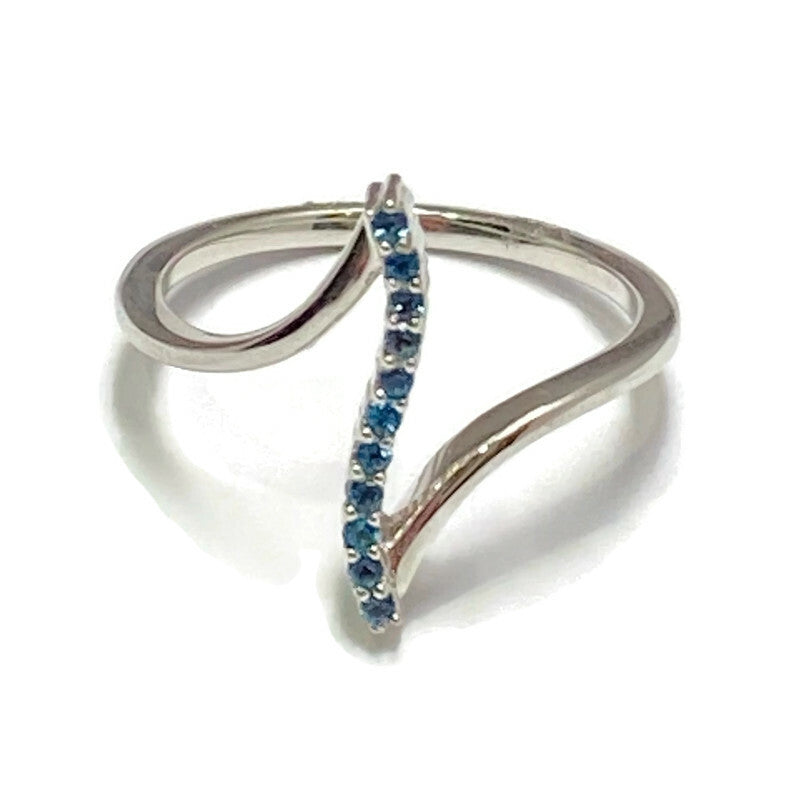 10K White Gold and Blue Topaz Off-Set Ring 800.00