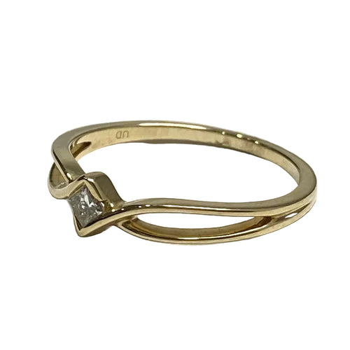 angled View of square cut diamond solitaire ring.