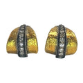 A pair of gold dome-shaped earrings with a textured finish, featuring a central channel set with clear round stones on a white background.