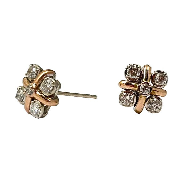 A pair of two-tone 14K gold stud earrings featuring white and rose gold with diamond accents.