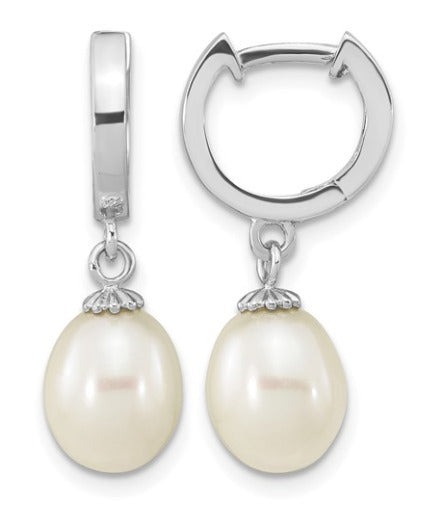 Silver huggie hoop earrings with oval freshwater pearl drops, shown on a plain white background.