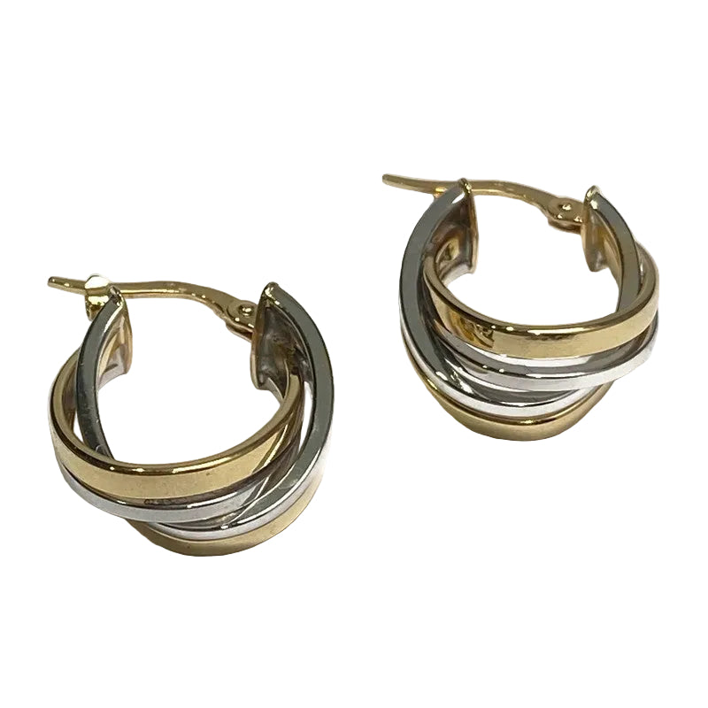 A pair of 14K yellow and white gold hoop earrings.