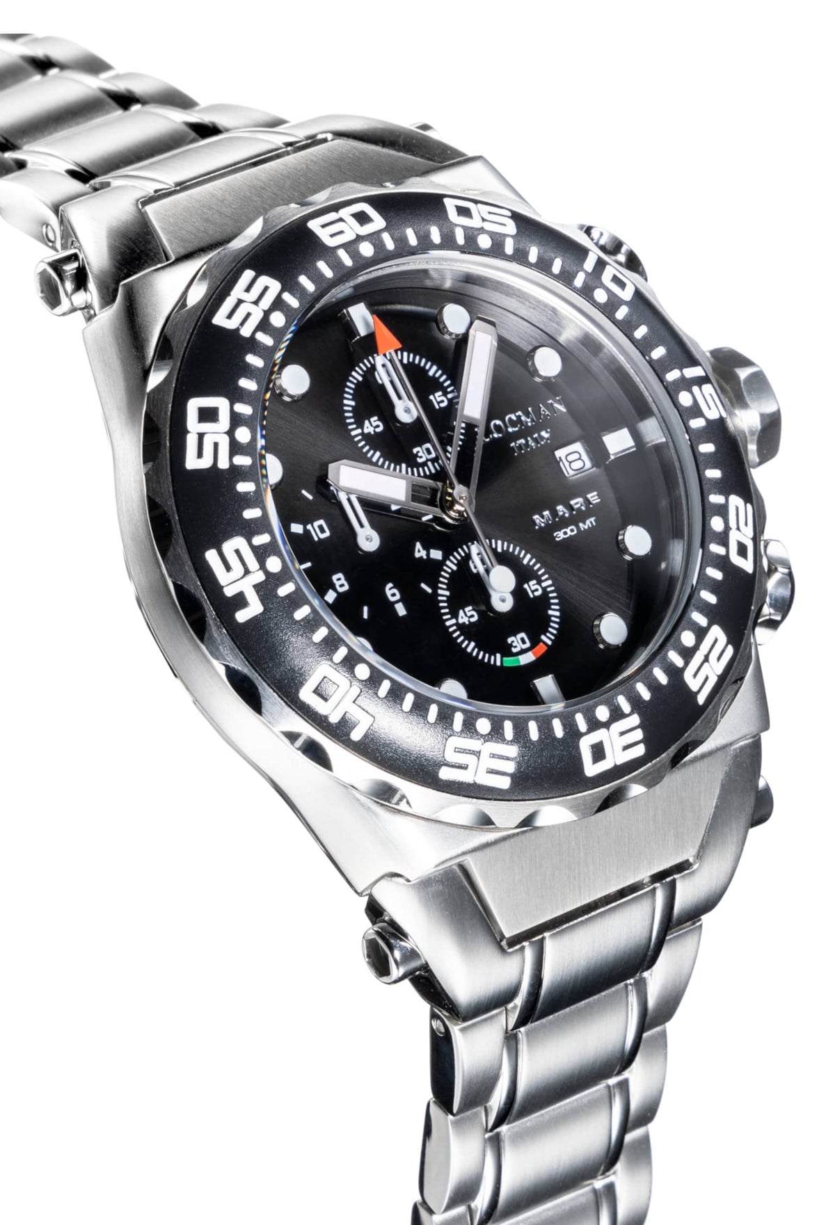 close up of face of watch. Black chronograph with a black dial and white lettering.